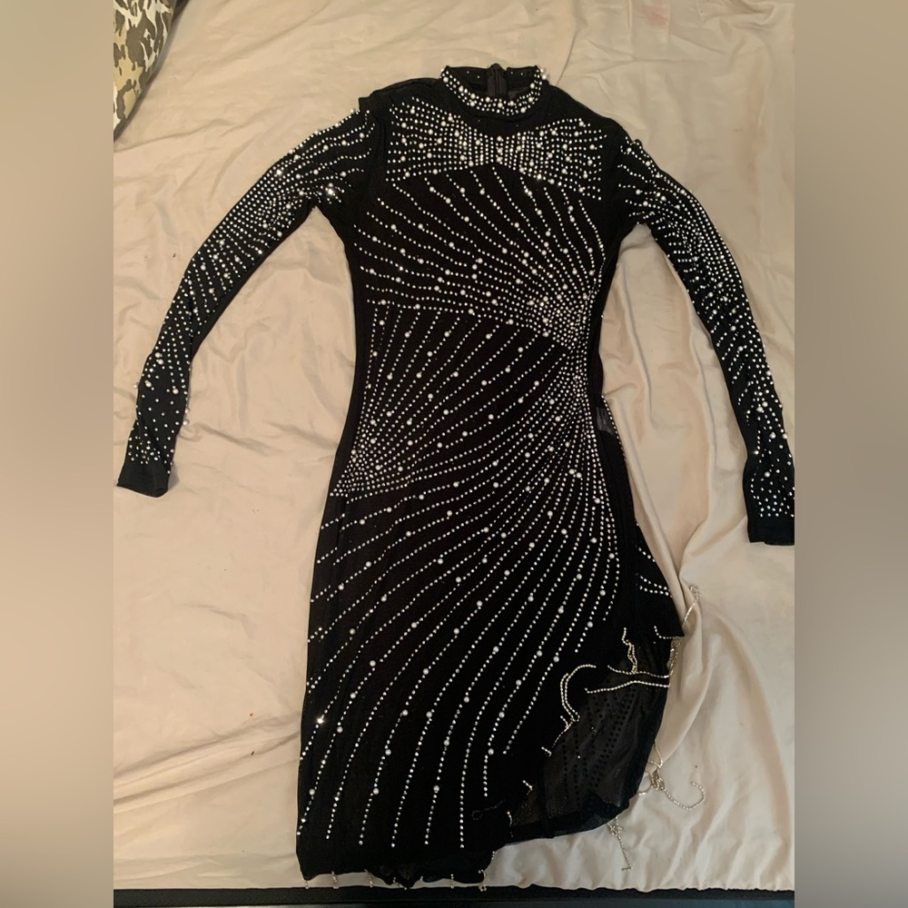 A medium sized club outfit , Branded by Amazon, Sheer material